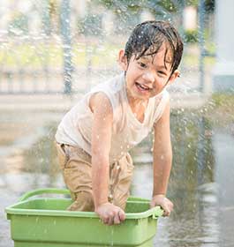 Asian-Boy-Playing-in-Louisville-Water-with-Hose-2 Asian-Boy-Playing-in-Louisville-Water-with-Hose-2