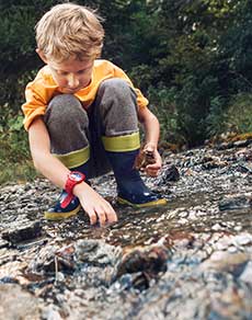 Boy-in-Boots-playing-in-Beargrass-Creek-Pollution Boy-in-Boots-playing-in-Beargrass-Creek-Pollution
